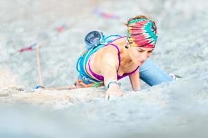 Girl practicing free climbing photo