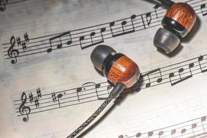 Musical score with earphones photo