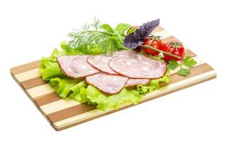 Sausages with salad and basil photo