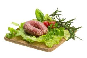 Salami with rosemary, salad and tomatoes photo