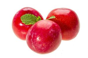 Bright ripe plum with mint photo