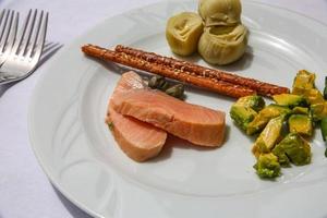 Salmon with avocado and artichoke photo