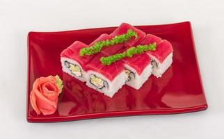 Maki Sushi - Roll made of Crab, avocado, cucumber inside. Fresh Tuna and tobico roe outside photo