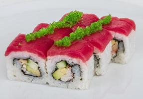 Maki Sushi - Roll made of Crab, avocado, cucumber inside. Fresh Tuna and tobico roe outside photo