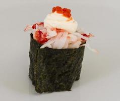 sushi kani with sauced slices of crab shrimp isolated on white background photo