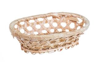 Wickerwork empty yellow breadbasket on white background photo