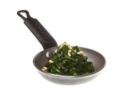 Boiled spinach on roasted pan photo