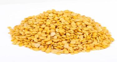 Yellow lentils isolated on white background.Macro shot photo