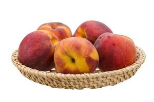 Bright ripe peaches photo