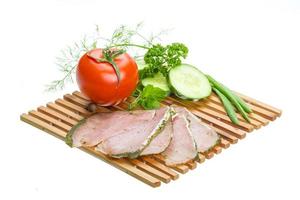 Ripe fresh ham with vegetables photo