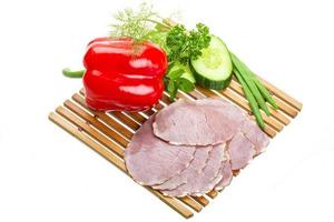 Ripe fresh ham with vegetables photo