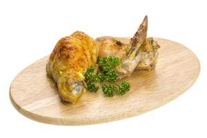 Roasted chicken with parsley and carry photo