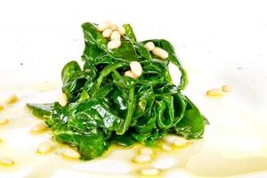 dish of the spinach with cedar nut photo