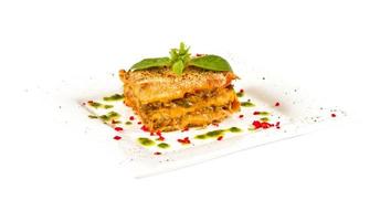 Closeup of lasagna and basil fork photo