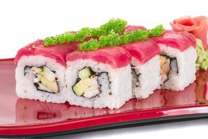 Maki Sushi - Roll made of Crab, avocado, cucumber inside. Fresh Tuna and tobico roe outside photo