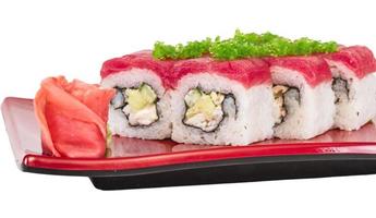 Maki Sushi - Roll made of Crab, avocado, cucumber inside. Fresh Tuna and tobico roe outside photo