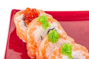 Japanese sushi traditional japanese food.Roll made of salmon, red cavair, roe and cream photo