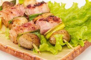 Bacon wrapped grilled Scallops with mushrooms and bacon photo