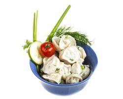 Bowl with traditional russian dish - pelmeni photo