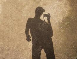 shadow of a man wearing a hat photo