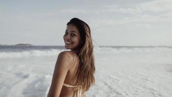 Latin young girl, famous beach Rio de Janeiro, Brazil. Latin summer vacation holiday. photo