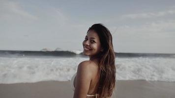 Latin young girl, famous beach Rio de Janeiro, Brazil. Latin summer vacation holiday. photo