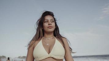 Latin young girl, famous beach Rio de Janeiro, Brazil. Latin summer vacation holiday. photo