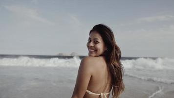 Latin young girl, famous beach Rio de Janeiro, Brazil. Latin summer vacation holiday. photo