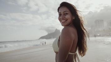 Latin young girl, famous beach Rio de Janeiro, Brazil. Latin summer vacation holiday. photo