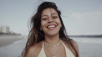 Latin young girl, famous beach Rio de Janeiro, Brazil. Latin summer vacation holiday. photo