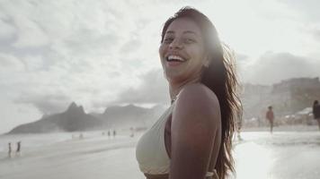 Latin young girl, famous beach Rio de Janeiro, Brazil. Latin summer vacation holiday. photo