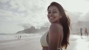 Latin young girl, famous beach Rio de Janeiro, Brazil. Latin summer vacation holiday. photo