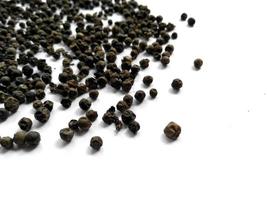 Black pepper on white background photo