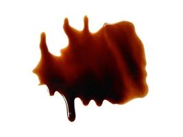 Spilled soy sauce sauce puddle isolated on white background. Texture of spilled soy sauce. Soy sauce on white background photo