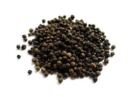 Black pepper isolated on a bowl photo