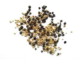 Coriander seeds and Black pepper on white background photo