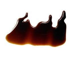 Texture of spilled soy sauce. Soy sauce on white background. Spilled soy sauce sauce puddle isolated on white background photo