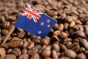 New Zealand flag on coffee bean, import export trade online commerce concept. photo