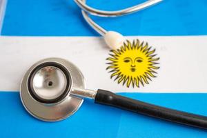 Black stethoscope on Argentina flag background, Business and finance concept. photo
