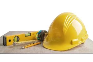 Safety first hard helmet hat and engineer tool with copy space, engineering construction and architecture concept. photo