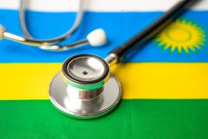 Black stethoscope on Rwanda flag background, Business and finance concept. photo