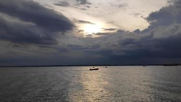 sky with thick clouds and sunset over the ocean photo