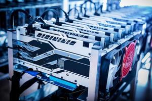 Bitcoin mining devices standing in a row. photo