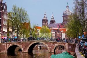 Amsterdam, Netherlands, 2022 - Amsterdam old town canal, boats. photo