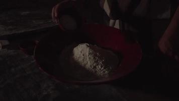 Slow Motion Hands Pour Flour into Big Bowl for Making Bread Dough video