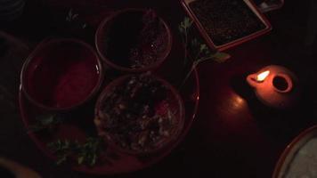 Pan of Table Set with Dishes of Spices Herbs in Candle Light