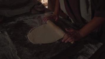 Man Rolls Out Dough on Floured Surface for Baking video