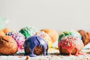 Decorated doughnuts on a kitchen counter. photo