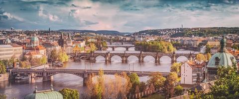 Prague, Czech Republic bridges skyline with historic Charles Bridge and Vltava river. Vintage photo