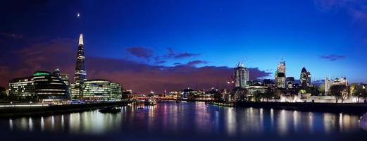 London skyline panorama at night, England the UK. Tower of London, the Shard and more photo